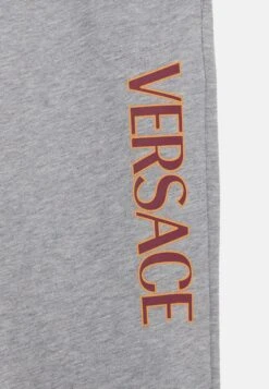 Versace LOGO KIDS PRINT UNISEX - Tracksuit Bottoms - Grey/garnet Red/spicy Honey -Zalando UK-Outlet 243ae99977bb4802a0a41211a8f18e69