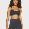 Reebok® X Victoria Beckham Li Seamless Bra - Light Support Sports Bra - Black
