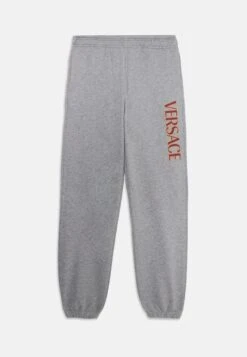 Versace LOGO KIDS PRINT UNISEX - Tracksuit Bottoms - Grey/garnet Red/spicy Honey