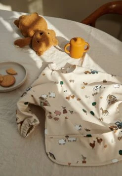 Liewood MERLE CAPE BIB UNISEX - Bib - Farm / Sandy -Zalando UK-Outlet fb034bb542d9478c943e95bceb7f109b